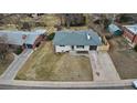 Charming single-story home featuring a well-maintained lawn and an attached one-car garage at 2765 S Winona Ct, Denver, CO 80236