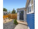 Inviting front entrance with a dark door, modern address numbers, gravel, and fresh landscaping details at 1021 Stuart St, Denver, CO 80204