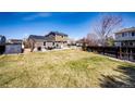 Expansive back yard with a patio set perfect for outdoor entertaining and relaxation at 2070 E 125Th Pl, Thornton, CO 80241