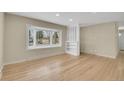 Bright living room featuring a large window and hardwood floors at 12022 W Dakota Dr, Lakewood, CO 80228