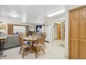 Open dining area with adjacent living space and tile flooring, great for entertaining at 625 S Clinton St # 7A, Denver, CO 80247