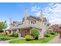 Charming townhome showcasing landscaped front yard and neutral siding at 4760 S Wadsworth Blvd # K205, Littleton, CO 80123