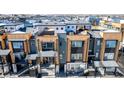 Modern townhouse complex featuring private rooftop terraces and stylish architectural details at 2361 Junegrass Ln, Louisville, CO 80027