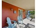 Inviting front porch with comfortable seating, perfect for relaxing outdoors at 2853 Yosemite St, Denver, CO 80238