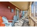Inviting front porch featuring comfortable seating, wood flooring, and an entrance to the house at 2853 Yosemite St, Denver, CO 80238