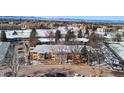 Aerial view of a apartment building in a serene community with ample parking at 705 S Clinton # 2A, Denver, CO 80247