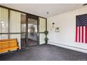 Inviting entrance lobby with American flag, bench seating, and secure entry system at 14300 E Marina Dr # 512, Aurora, CO 80014
