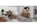 Bright living room featuring neutral décor and carpet at 1723 Robb St # 44, Lakewood, CO 80215
