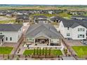 Expansive backyard with a covered patio, garden, and stylish outdoor seating area in a desirable neighborhood at 228 Rogers Ct, Castle Rock, CO 80104