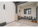 Cozy outdoor patio with comfortable seating, stylish lighting, and a tranquil ambiance at 8765 Canyon Wind St, Parker, CO 80138