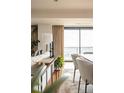 Bright living space featuring a modern sofa, stylish decor, and large windows with city views at 1133 14Th St # 2000, Denver, CO 80202
