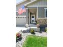 Inviting front porch with stone accents, ideal for enjoying the outdoors and neighborhood views at 4635 S Odessa St, Centennial, CO 80015