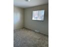 Bedroom with a window, neutral walls, and carpeted floors at 7331 Utica St, Westminster, CO 80030