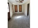 Bright living room with ceiling fan and window at 7331 Utica St, Westminster, CO 80030
