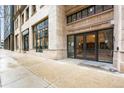 Midland Lofts entryway at 666 Seventeenth Street, featuring glass doors and stone facade at 444 17Th St # 603, Denver, CO 80202