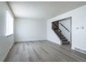 Bright living room boasts new floors, fresh paint, and lots of natural light at 8627 Santa Fe Dr, Thornton, CO 80260