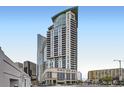 Modern high-rise building with sleek architectural design featuring balconies and city views from a street-level perspective at 2001 Lincoln St # 2213, Denver, CO 80202