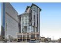 Modern high-rise building showcasing sleek architecture and a glass facade at 2001 Lincoln St # 2213, Denver, CO 80202