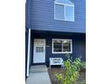 The exterior of this home features blue siding, a white front door, and charming bench seating at 3294 Sentinel Dr, Boulder, CO 80301
