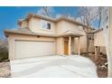 Charming two-story home with an attached garage and covered front entry at 2304 S Holly St # A, Denver, CO 80222