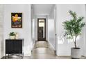 Bright hallway with sleek floors, accent art, and modern decor, creating a welcoming space at 4752 Eliot St, Denver, CO 80211