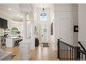Bright foyer with soaring ceilings, hardwood floors and open floor plan at 7007 S Garrison St, Littleton, CO 80128