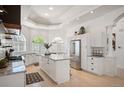 Bright, spacious kitchen with granite countertops, large island, and stainless appliances at 7007 S Garrison St, Littleton, CO 80128