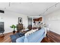 Inviting living room boasts hardwood floors, stylish decor, and an open layout to the kitchen at 100 Park Ave # 907, Denver, CO 80205