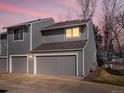 Charming two-story home featuring a two-car garage, gray siding, and well-maintained landscaping at 277 S Taft Ct # 54, Louisville, CO 80027