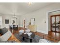 Inviting living room showcasing hardwood floors and seamless flow to other living spaces at 1031 S Pennsylvania St, Denver, CO 80209