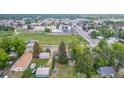 A birds eye view shows the house and surrounding area with parks and businesses nearby at 8450 W 13Th St, Lakewood, CO 80215