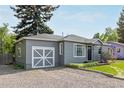 Charming single Gathering home featuring a well-manicured lawn and delightful curb appeal at 8450 W 13Th St, Lakewood, CO 80215