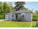Charming single Gathering home featuring a well-manicured lawn and delightful curb appeal at 8450 W 13Th St, Lakewood, CO 80215