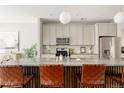 Modern kitchen with granite countertops and stainless steel appliances at 1576 W Maple Ave, Denver, CO 80223