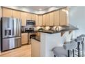 Kitchen boasts stainless steel appliances and a breakfast bar with seating at 4137 Clifton Ct, Boulder, CO 80301