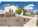 A charming single-Gathering home with well-kept front yard in a suburban neighborhood at 11124 Xanadu St, Commerce City, CO 80022