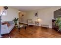 Inviting living room featuring hardwood floors, stylish furnishings, and ample natural light at 1085 N Lafayette St # 704, Denver, CO 80218