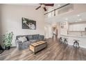 Spacious living area with high ceilings, sleek hardwood floors, and stylish decor throughout at 13421 Humboldt Way, Thornton, CO 80241