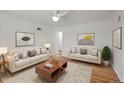 Bright living room features hardwood floors, modern decor, and neutral color scheme at 3368 S Corona St, Englewood, CO 80113