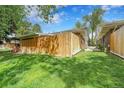 Side yard of home with privacy fence and sprawling green grass at 7902 Meade St # A10, Westminster, CO 80030