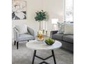 Cozy living area featuring neutral colors, decorative accents, and a comfortable seating arrangement at 3408 S Kittredge St, Aurora, CO 80013