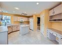 Bright kitchen with an island, updated appliances, and ample counter space is ready for cooking at 5163 Apache Creek Rd, Castle Rock, CO 80109
