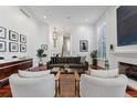 Spacious living area with a stylish decor, high ceilings, and seamless flow for entertaining and relaxing at 4032 S Olive St, Denver, CO 80237