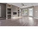 Spacious living room showcases a modern fireplace, built-in shelving, and neutral-toned walls at 2008 S Galapago St, Denver, CO 80223