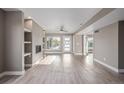 Expansive living room with a fireplace, neutral walls, recessed lighting, and vinyl flooring at 2008 S Galapago St, Denver, CO 80223