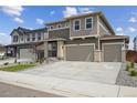 Beautiful two-story home with a two car garage, manicured landscaping, and a cozy front entry at 45915 Wood Thrush Ave, Bennett, CO 80102