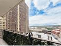 Balcony view of city buildings and blue sky with skyline in the distance at 1020 15Th St # 12C, Denver, CO 80202