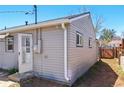 Exterior shot of a house exhibiting its siding and windows in a residential neighborhood at 764 S Osage St, Denver, CO 80223