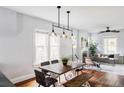 Dining room with wood table, bench and view of living room at 4430 Zuni St, Denver, CO 80211