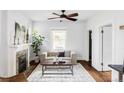 Bright living room with hardwood floors, fireplace and stylish decor at 4430 Zuni St, Denver, CO 80211